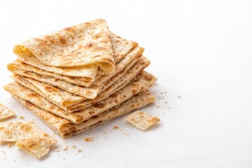 Fototapeta premium Crisp lavash bread set against bright white paper backdrop with copy space