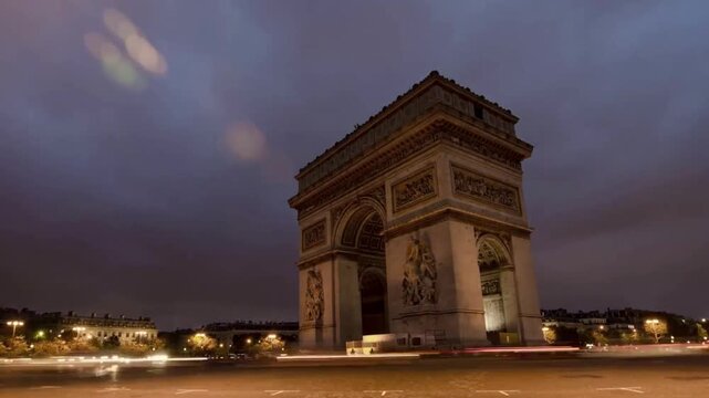 Arc de Triomphe monument with traffic on Champs Elysees in Paris France in 4K