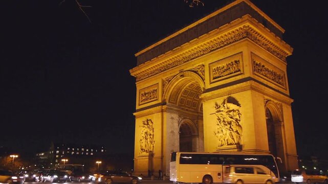 Arc de Triomphe monument with traffic on Champs Elysees in Paris France in 4K