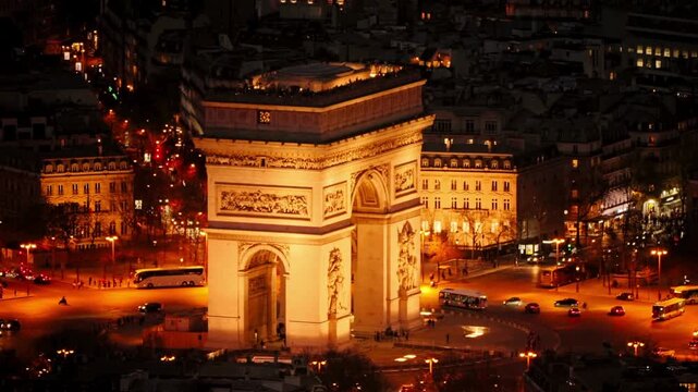 Arc de Triomphe monument with traffic on Champs Elysees in Paris France in 4K
