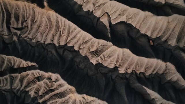 16 March 2026: Aerial view of textured mountain ridges with deep shadows and eroded slopes.