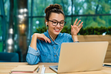 Laptop, young woman for business webinar, virtual training or greeting for productivity lecture. Introduction, office or employee with pc for online engagement, optimization or video call workshop © InsideCreativeHouse