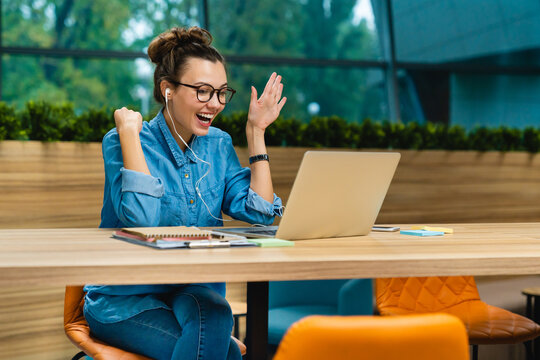 Happy, portrait and young business woman with video call or wave for virtual meeting, online chat or talk at office. Face, female person for communication, presentation or connection