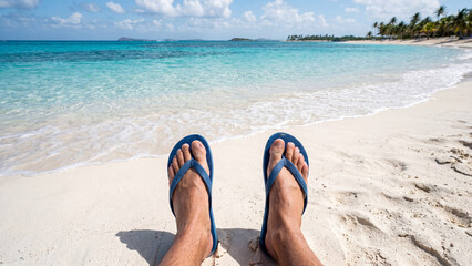 Naklejka premium First Person View of Feet in Blue Flip Flops on Tropical Beach