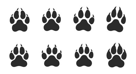 Fototapeta premium Animal paw prints silhouette set on a white background