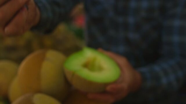 Local market culture authentic street market life with fresh melon tasting, vendor cutting and offering fruit sample at busy bazaar, healthy food concept