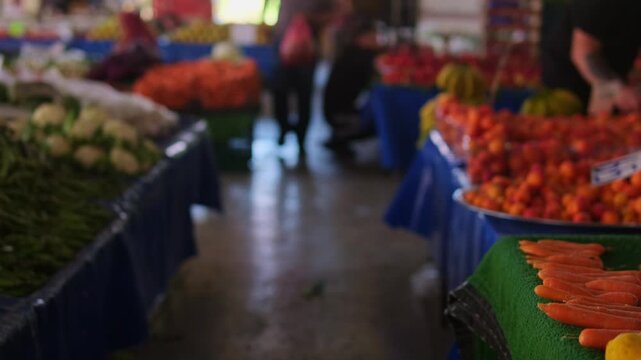 Local market culture authentic street market life narrow aisle between fruit and vegetable stalls, blurred busy bazaar background, everyday shopping concept