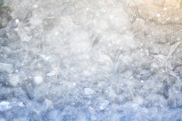 Obraz premium white winter background, frosty patterns on glass, abstract backdrop of ice and snow crystals in a blur