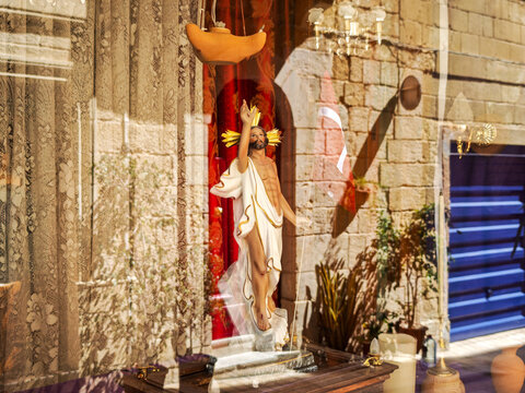 Christ statue on a house of Vittoriosa in Malta