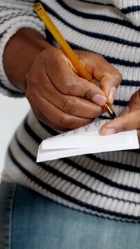 Dark Skinned Woman Hand Writing on Paper with Pen in Creative Workspace Close Up