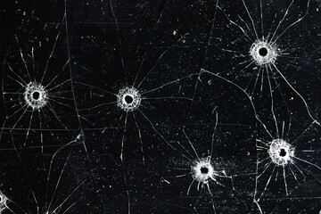 Fototapeta premium Bullet holes on black glass, overlay design background