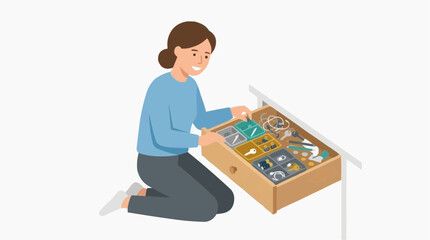 Fototapeta premium Woman organizing a drawer with keys and small items in organizers
