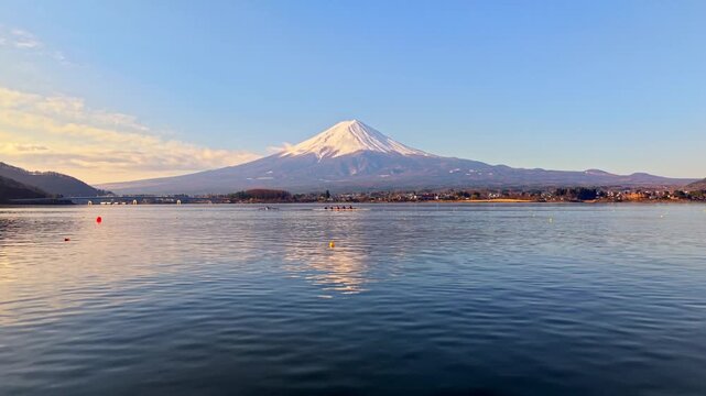 Rowing team practicing on Lake Kawaguchi with scenic view of Mount Fuji in Japan.