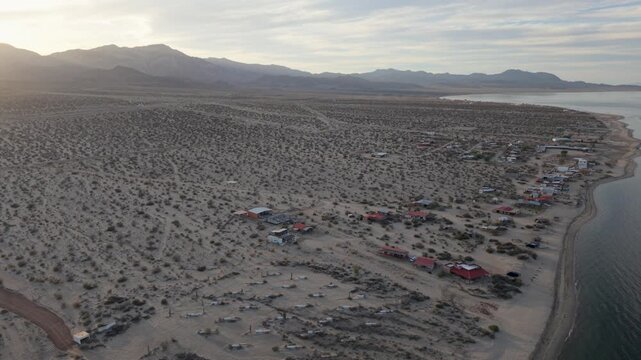 Aerial shots show Bahia de Los Angeles in Baja California as the sun sets over the Sea of Cortez in the late afternoon hours.