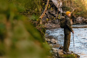 Fototapeta premium Male Hiker Standing by Canyon River