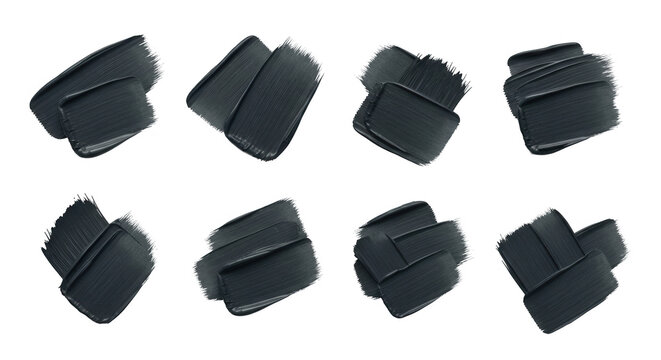 brush strokes of black paint swatches on a white background texture for art supplies design concepts or cosmetics