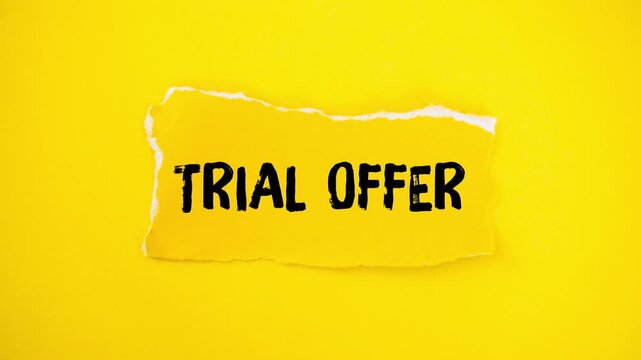 Trial offer message writing on a ripped piece of paper. Concept for marketing, promotion, special sales, and free product sampling. Stop motion animation on a yellow background