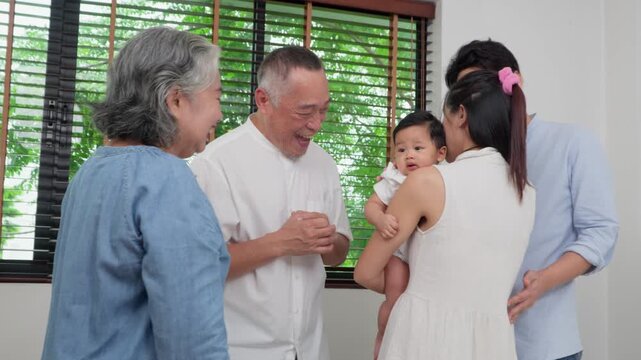Family Bond: A tender moment unfolds as a multigenerational family gathers, their faces alight with affection and happiness.