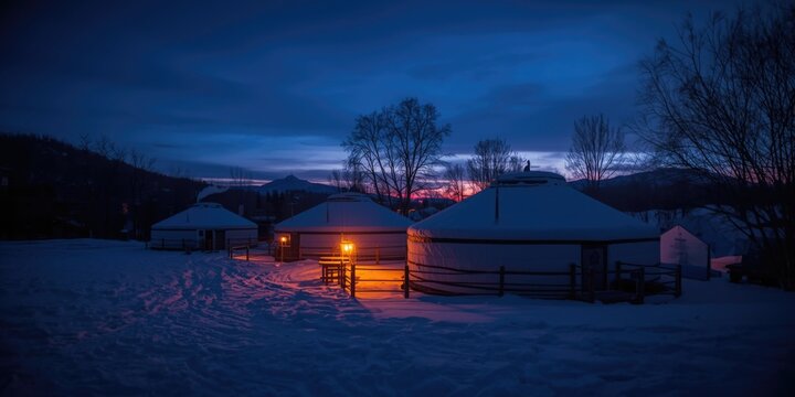 Blue hour outdoor tourism scene featuring a traditional yurt restaurant in winter