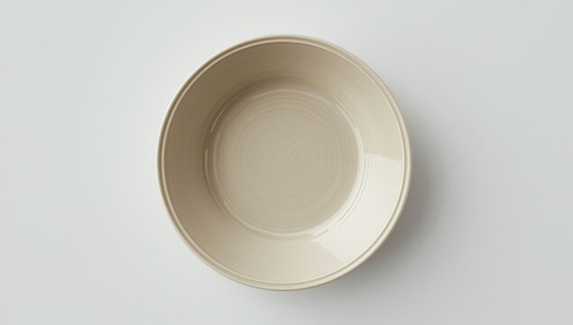 Birds eye perspective of elegant beige porcelain dish on white