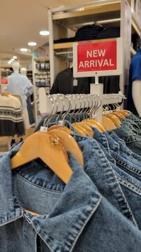 New Arrival sale sign at a clothing store