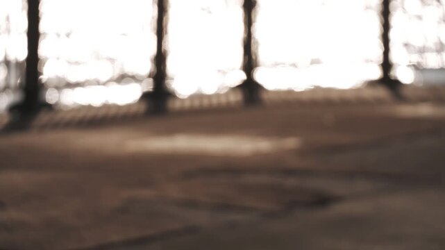 A coastal deck fence with a reflective ocean surface in the background