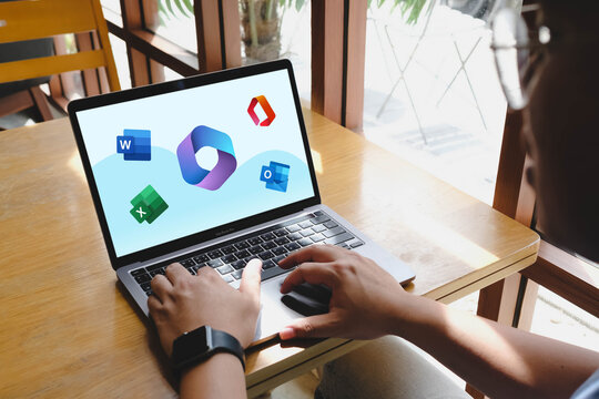 Bangkok, Thailand. May 9, 2026; An over the shoulder view of a person using a laptop to access Microsoft 365 productivity applications including Word, Excel, and Outlook.