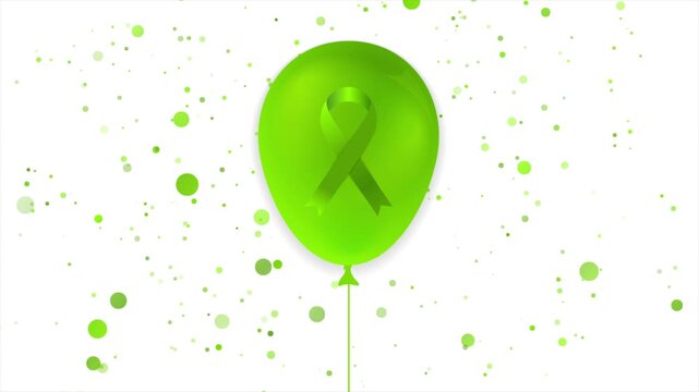 Green ribbon symbol on glossy balloon with flying confetti for medical health care support. Mental Health Awareness Month concept motion design. Video animation Ultra HD 4K 3840x2160