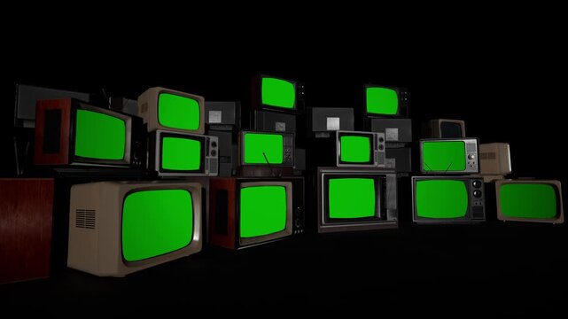 Stack of old vintage retro CRT televisions with green screens in a dark room, ready for chroma key compositing. Perfect for retro, 80s, 90s, nostalgia, media, and broadcast content templates.