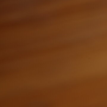 Smooth brown silk fabric flowing in soft warm light