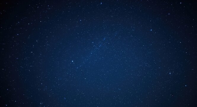 A deep blue star filled night sky in a vast space environment