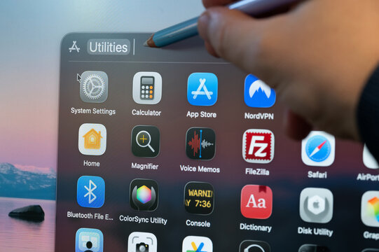 Selecting computer utilities app on screen menu