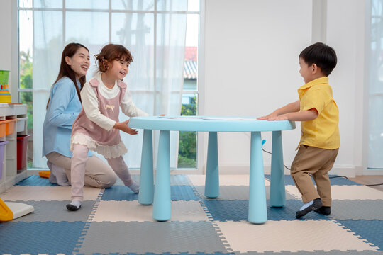 Fun Indoor Play with Kids and Carer at Activity Table
