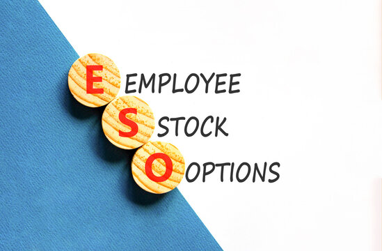 ESO employee stock options symbol. Concept words ESO employee stock options on beautiful wooden circles. Beautiful white blue background. Business ESO employee stock options concept. Copy space.