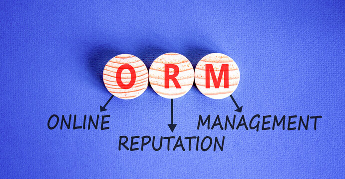 ORM online reputation management symbol. Concept words ORM online reputation management on beautiful wooden circles. Beautiful blue background. Business ORM concept. Copy space.