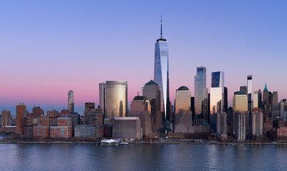 Fototapeta premium Manhattan skyline. New York City wide panoramic skyline. New York cityscape along the waterfront. NYC aerial skyline above downtown Manhattan. New York City landscape with skyscrapers.