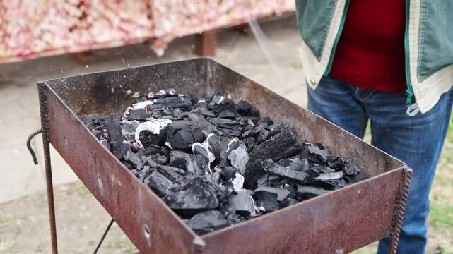 How to prepare charcoal for grilling in a backyard setting