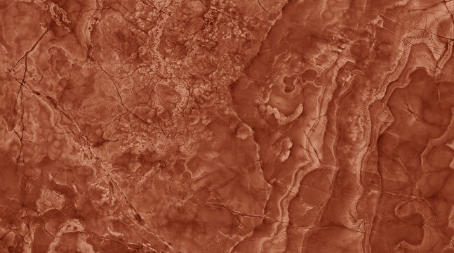 A close-up view of a rich, textured rust-colored surface with intricate patterns resembling natural geological formations.