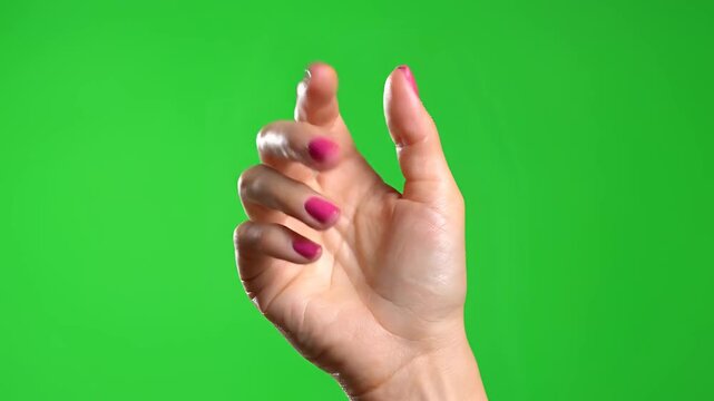 Closeup of a Womans Hand Showing Thumbs Up Gesture on a Green Screen Background.