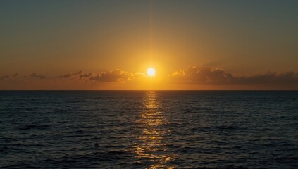 Fototapeta premium Sun Rising Over Tropical Sea Horizon Early Morning, Warm Colors, Calm Waters