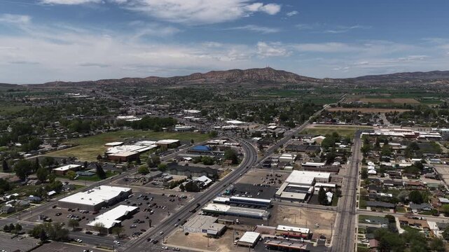 High wide aerial over Vernal Utah small desert town in Uinta Mountains