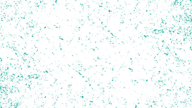 Teal splattered paint on white surface with scattered spots and smudges everywhere around