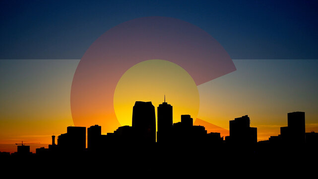 Denver Skyline Sunrise with Colorado Flag in Sky