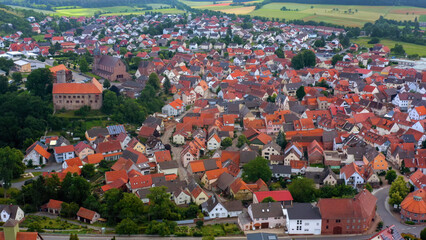 Naklejka premium Aerial view of the old town above the city Külsheim in Germany on a sunny summer day.