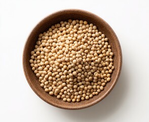 Fototapeta premium Top-down view of a rustic bowl brimming with small, light brown, oval-shaped legumes