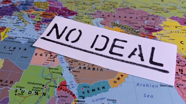 No deal note sliding over map of Iran and Strait of Hormuz. Conceptualizing failed peace talks, nuclear standoff, geopolitical crisis, and tense foreign policy diplomacy.