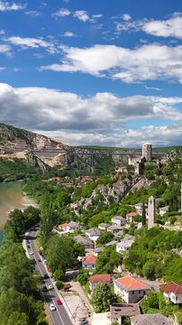 Vertical aerial view of the medieval village Počitelj in southern Bosnia and Herzegovina. It shows the stone fortress. Narrow streets run through the village. 
