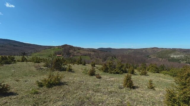 Clear blue sky dominates the mountain scene. Mount Goc, Ljukten peak. Balkans, Serbia