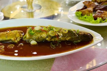 North Korean cuisine. Baked river fish © Oleg Znamenskiy