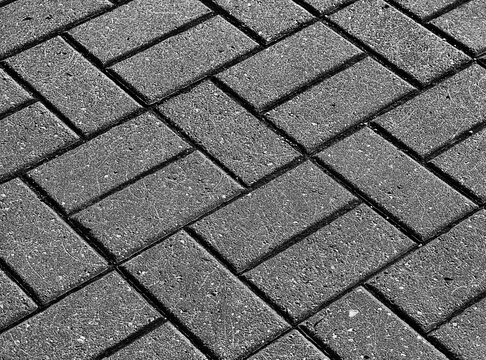 Black and white tiled street pavement texture backdrop